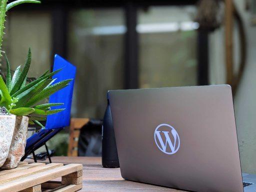 The WordPress logo on a a macbook.