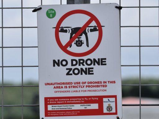 no drone zone signage on the fence